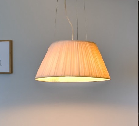 Pleated pendant lamp above the seating area