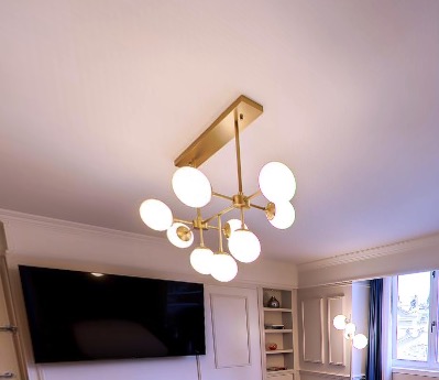 Brass chandelier with globe lights in the living area