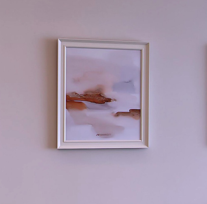 Abstract painting bearing the JW Marriott signet