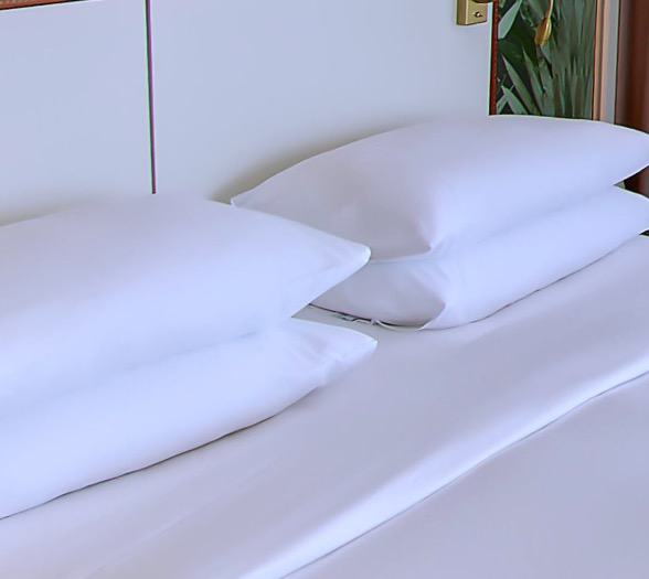 Stacked pillows on the bed