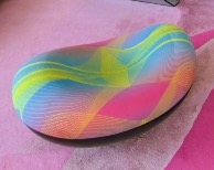 Round lounge stool with a rainbow pattern