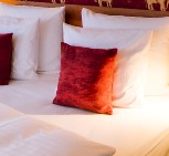 Decorative cushion on the bed in the Family Suite