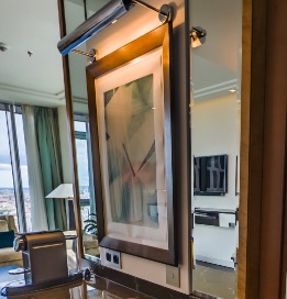 Framed artwork with its own picture light